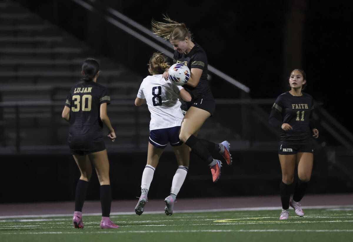 Faith Lutheran's Allie Rabe (28) heads the ball against Shadow Ridge's Harmony Taylor ...