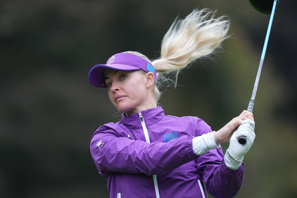 Charley Hull, of World team, tees off on the ninth hole during the semifinal against Australia ...