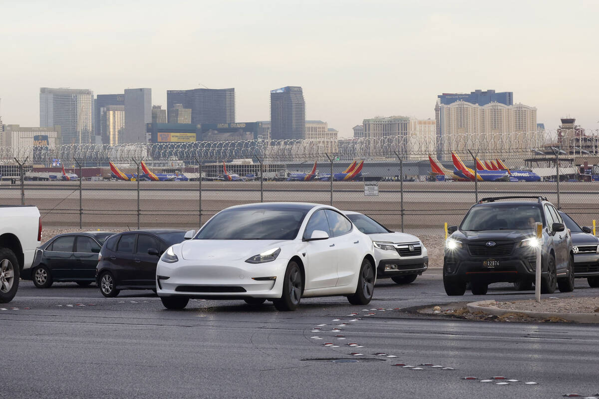 Motorists navigate on Sunset Road after exiting from the Airport Connector Interchange off-ramp ...