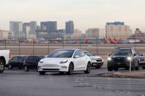 Motorists navigate on Sunset Road after exiting from the Airport Connector Interchange off-ramp ...