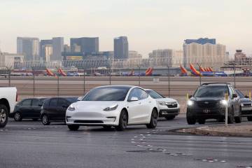 Motorists navigate on Sunset Road after exiting from the Airport Connector Interchange off-ramp ...