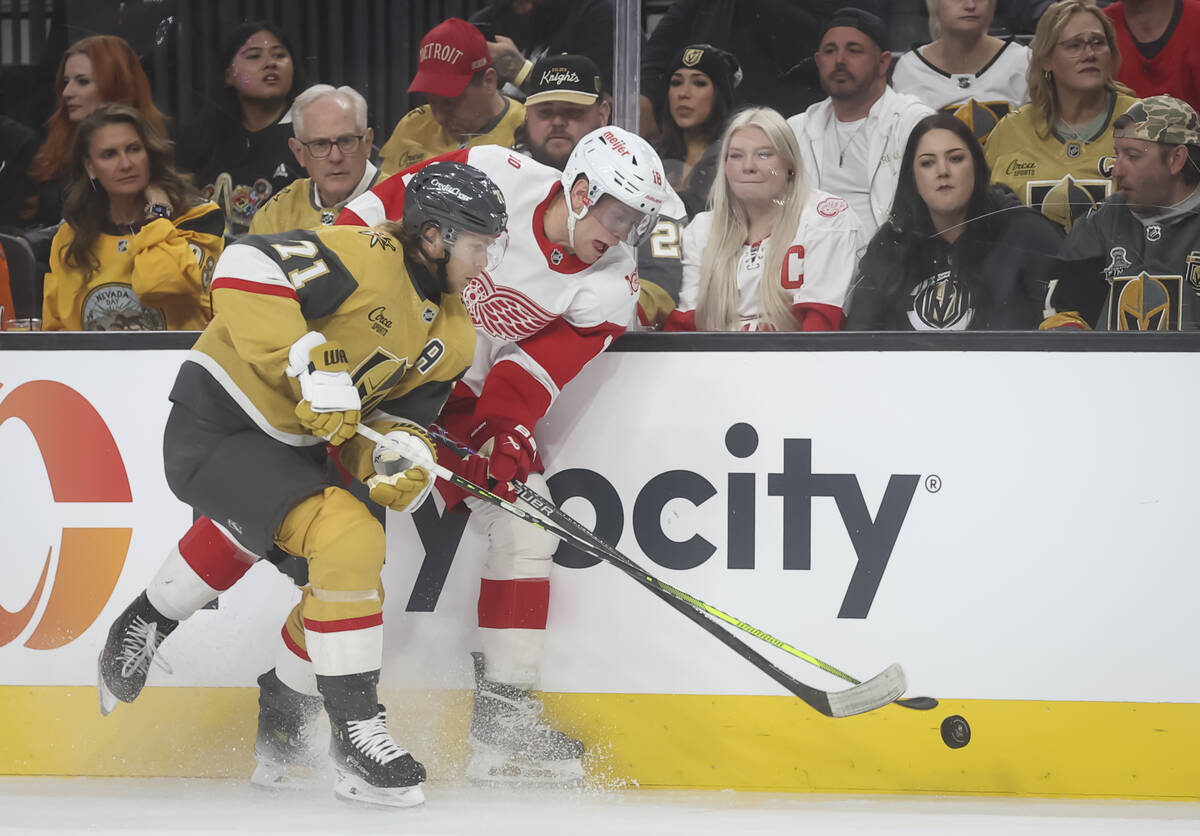 Golden Knights center William Karlsson (71) and Detroit Red Wings center Andrew Copp (18) vie f ...