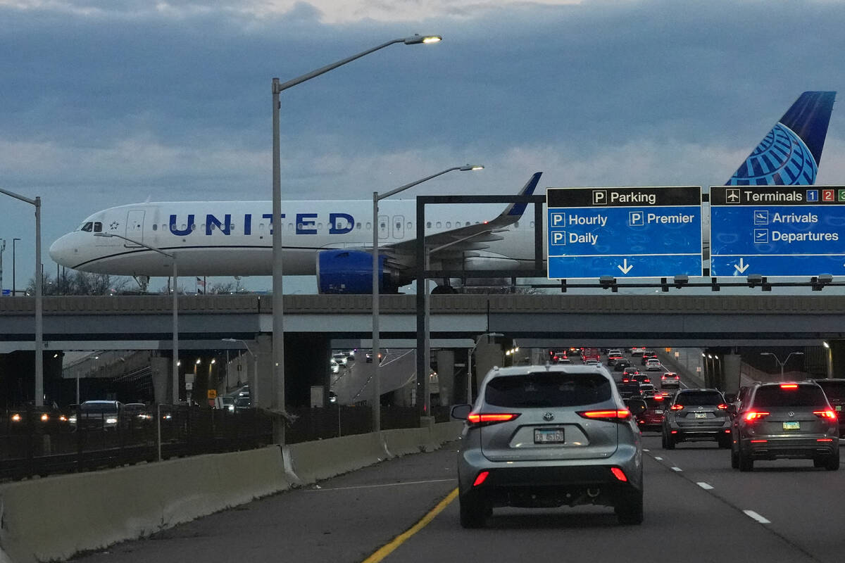 An United Airlines flight arrives at O'Hare International Airport in Chicago, Monday, Nov. ...