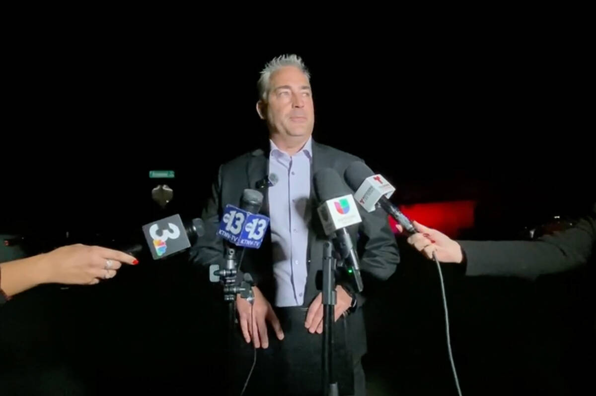 Metro Police Lt. Robert Price speaks to the press outside the scene where two bodies were found ...