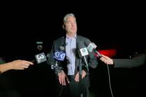 Metro Police Lt. Robert Price speaks to the press outside the scene where two bodies were found ...