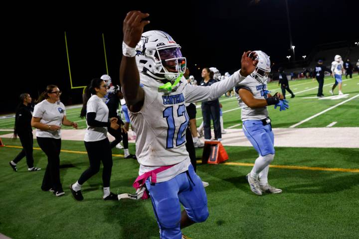 Centennial quarterback Nehemiah Dunlap Myvett (12) celebrates after defeating Shadow Ridge in ...