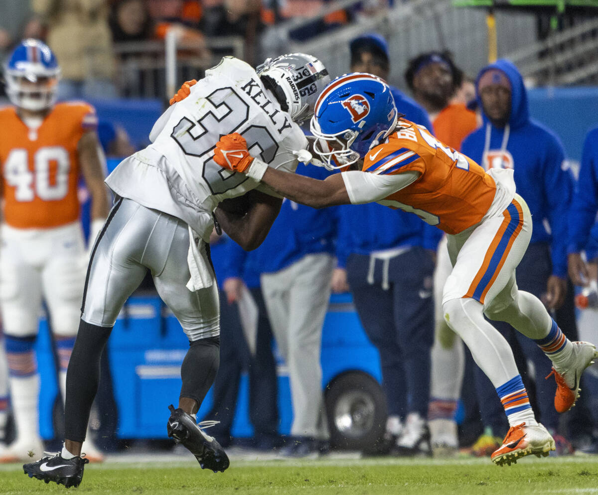 Raiders cornerback Kyu Blu Kelly (36) intercepts a pass intended for Denver Broncos wide receiv ...