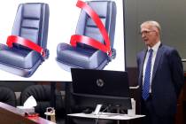 A lap belt, left, and a three-point automobile safety belt designs are displayed as attorney Ro ...