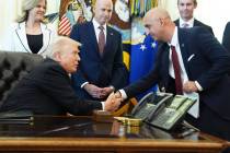 President Donald Trump, left, shakes the hand of Novo Nordisk President and CEO Mike Doustdar d ...