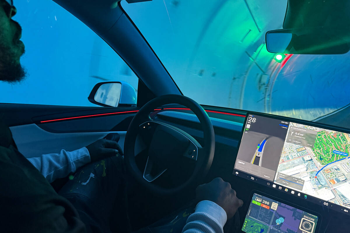 A Boring Co. employee serves as a safety driver during a self-driving ride in the Vegas Loop on ...