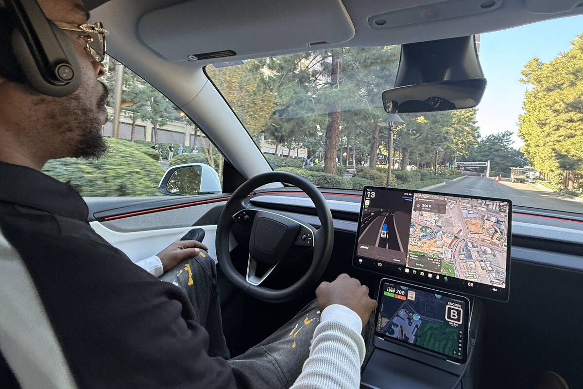 A Boring Co. employee serves as a safety driver during a self-driving ride in the Vegas Loop on ...