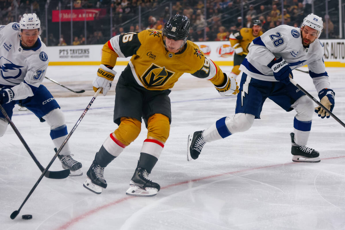 Golden Knights left wing Pavel Dorofeyev (16) controls the puck between Tampa Bay Lightning goa ...