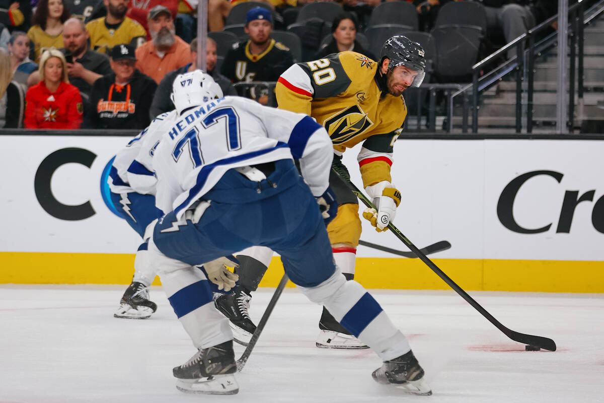 Golden Knights left wing Brandon Saad (20) looks for a shot on goal around Tampa Bay Lightning ...