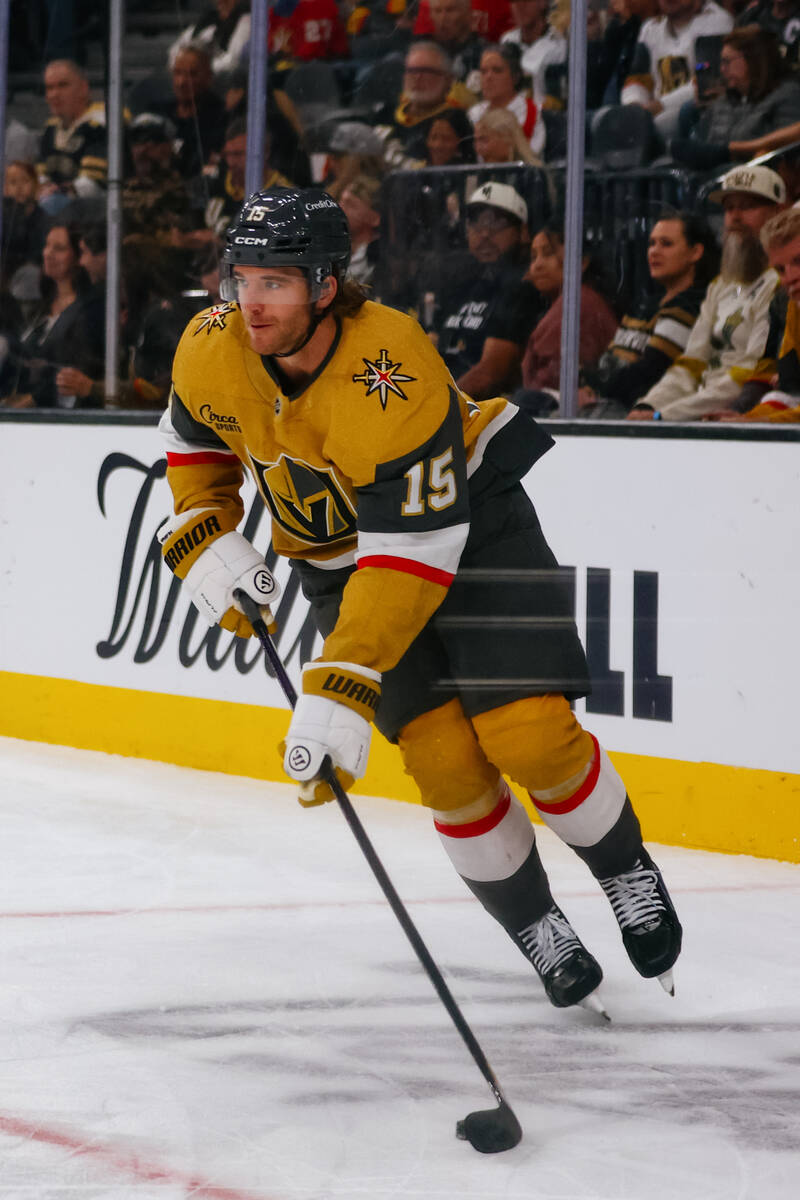 Golden Knights defenseman Noah Hanifin (15) skates with the puck in the second period of the ga ...