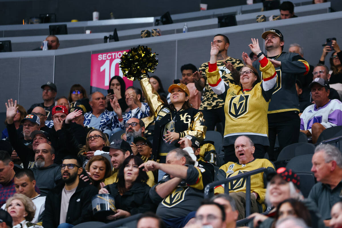 Fans dance to try and appear on the jumbotron in the third period of the game on Thursday, Nov. ...