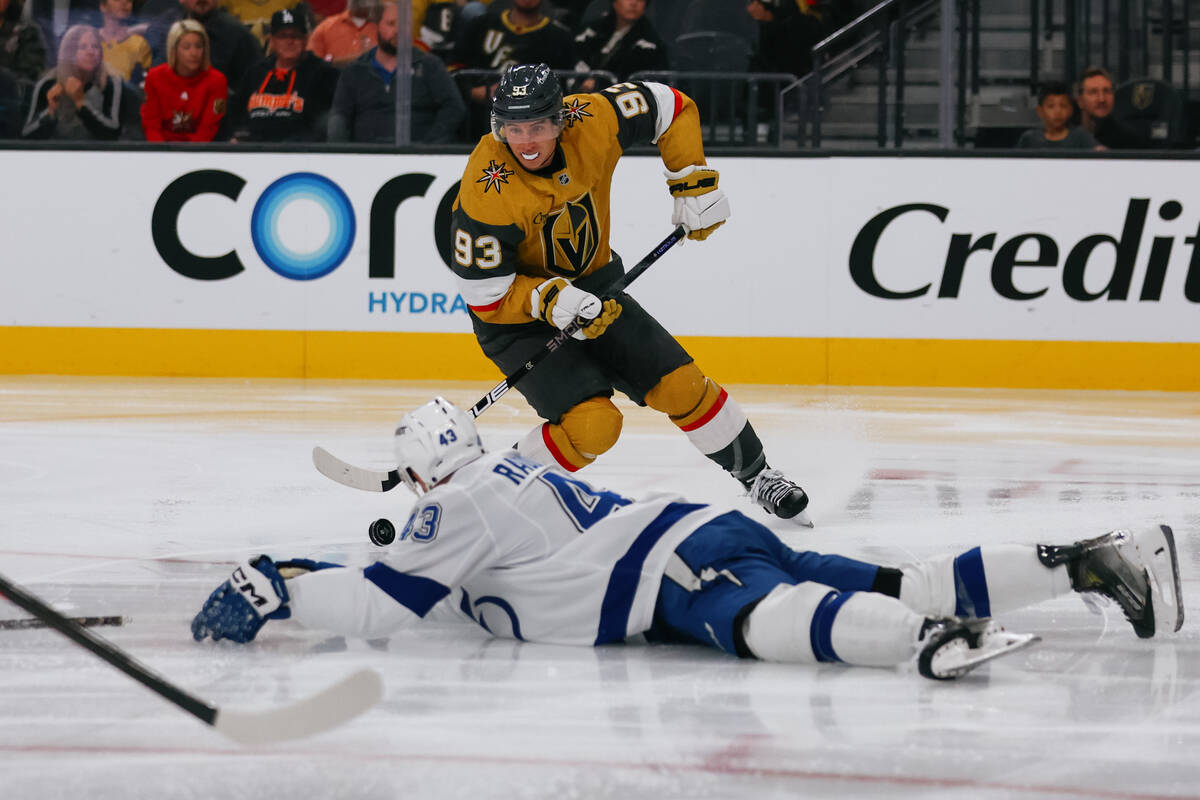 Golden Knights right wing Mitch Marner (93) gains control of the puck in the third period of th ...