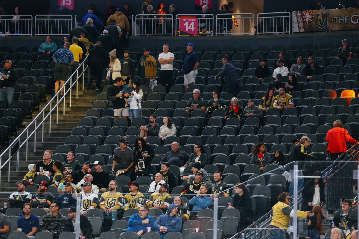 Fans leave the game with 16 seconds left in the third period of the game on Thursday, Nov. 6, 2 ...