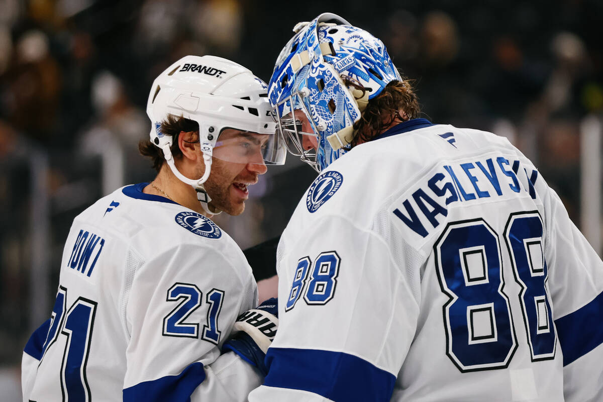 Tampa Bay Lightning center Brayden Point (21) and Tampa Bay Lightning goaltender Andrei Vasilev ...