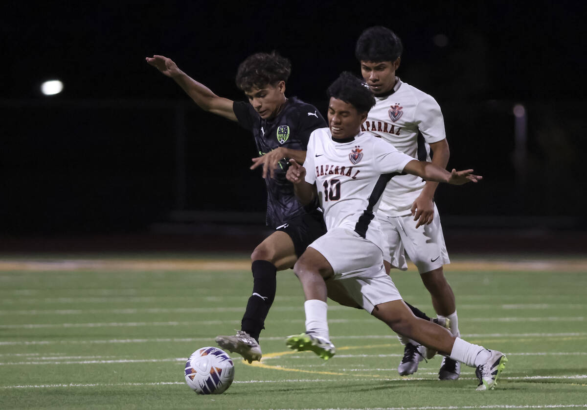 SLAM! Nevada's midfielder Riquelme Martinez, left, and Chaparral's Skander Herrera (1 ...