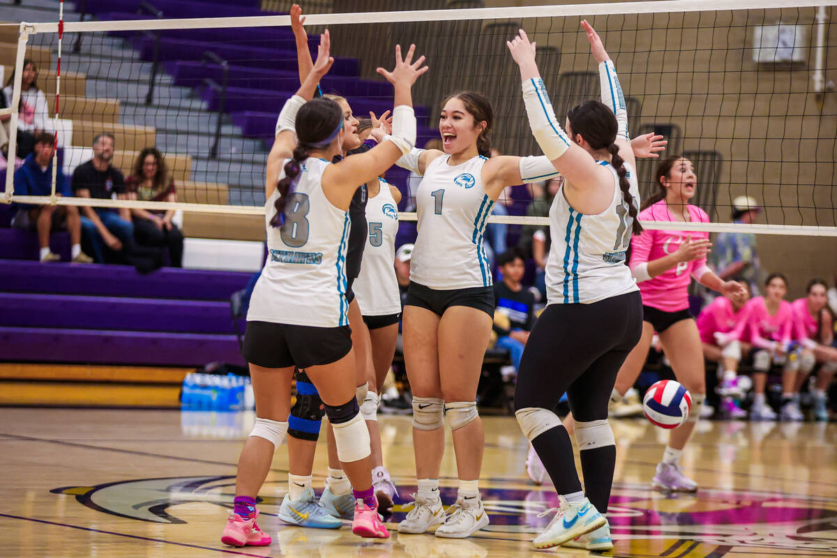 Silverado players celebrate during a class 4A girls volleyball state semifinals game at Sunrise ...