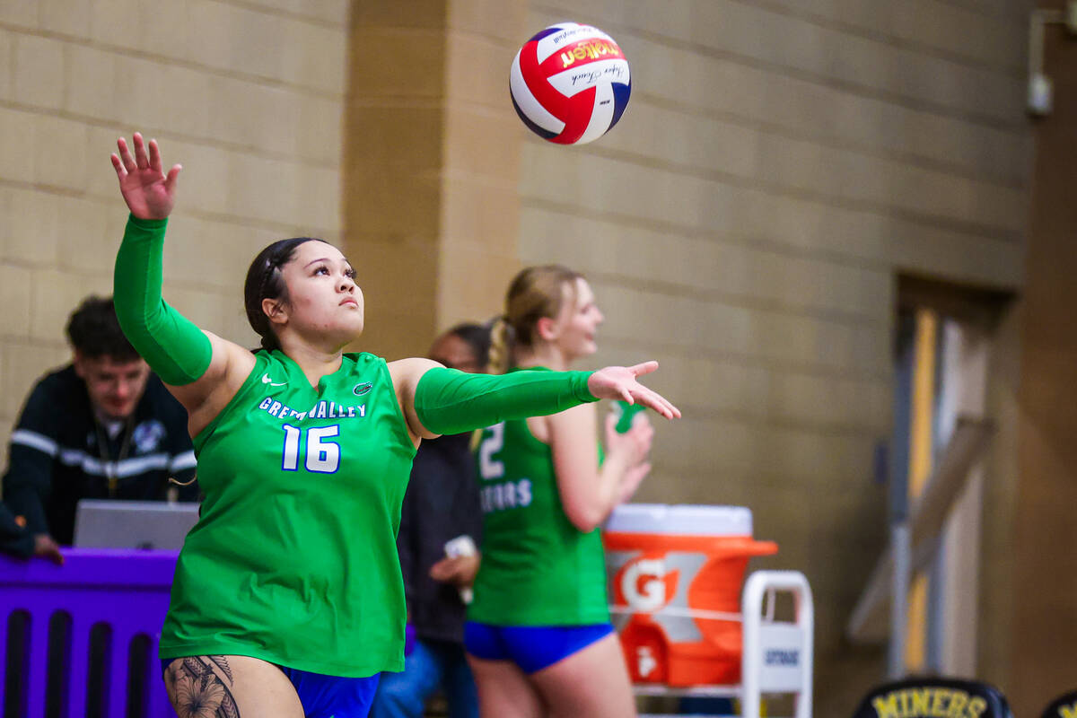 Green Valley defensive specialist Shaena Cozo serves the ball during a class 4A girls volleybal ...