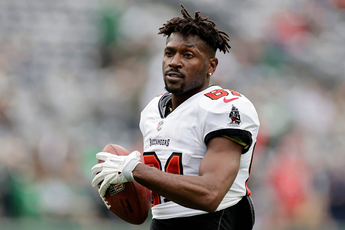 FILE - Tampa Bay Buccaneers wide receiver Antonio Brown (81) walks on the field during an NFL f ...