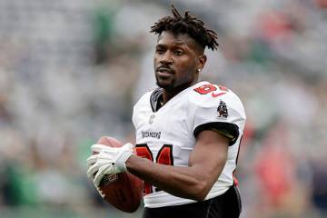 FILE - Tampa Bay Buccaneers wide receiver Antonio Brown (81) walks on the field during an NFL f ...