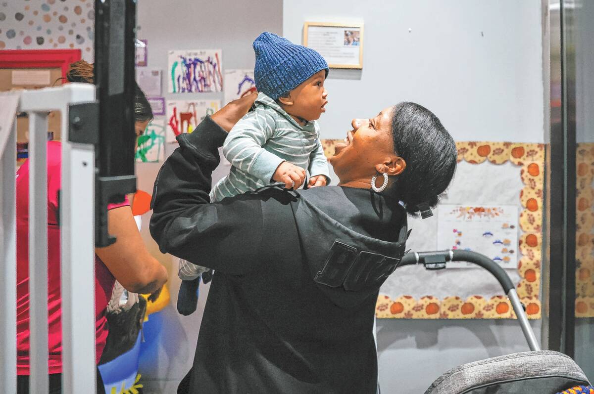 Jassmyne Collette-Koonce picks up her 7-month-old son from Artsy Nannies after her study sessio ...