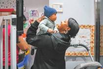 Jassmyne Collette-Koonce picks up her 7-month-old son from Artsy Nannies after her study sessio ...