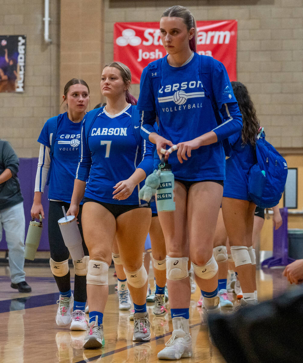Carson players head to the court before a Class 5A girls volleyball state semifinal match again ...