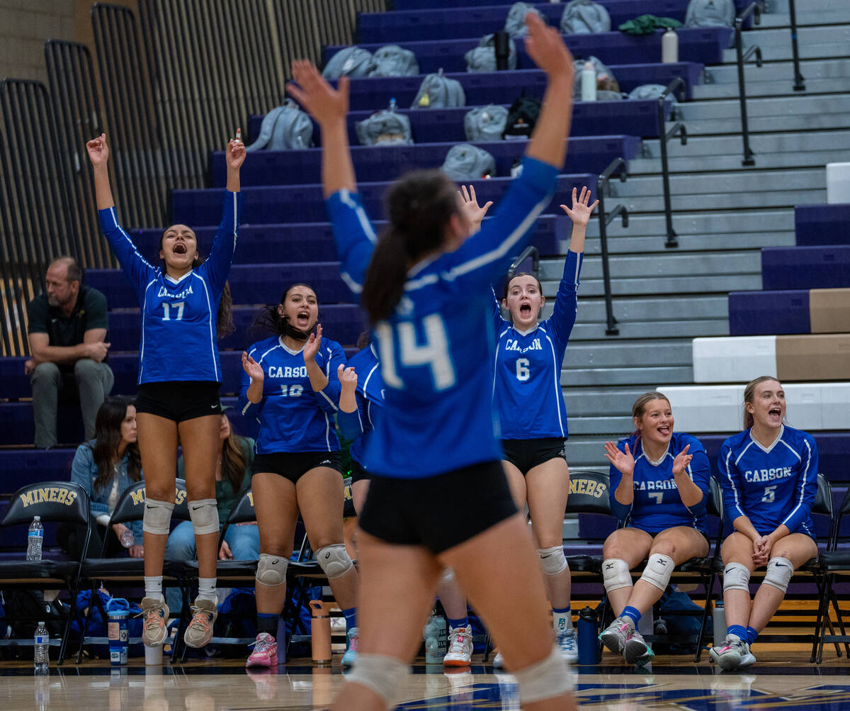 Carson celebrates after winning a point against Bishop Gorman in a Class 5A girls volleyball st ...
