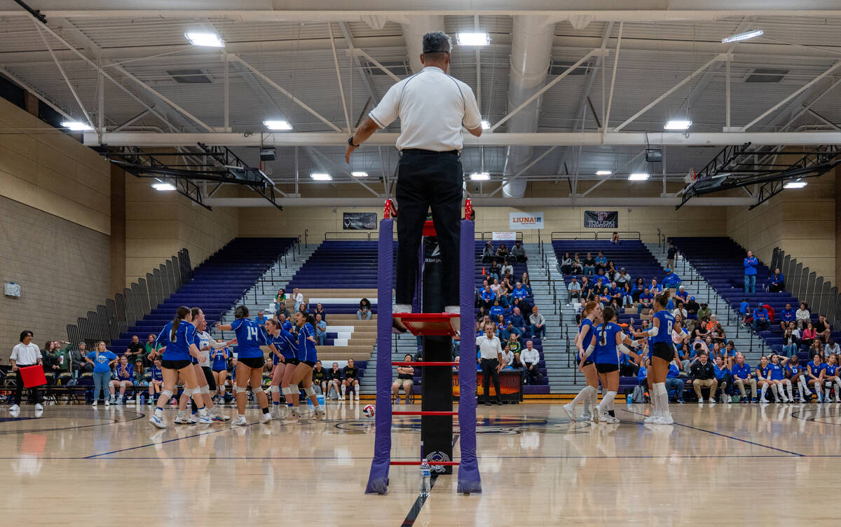 Carson and Bishop Gorman huddle in between plays during a Class 5A girls volleyball state semif ...