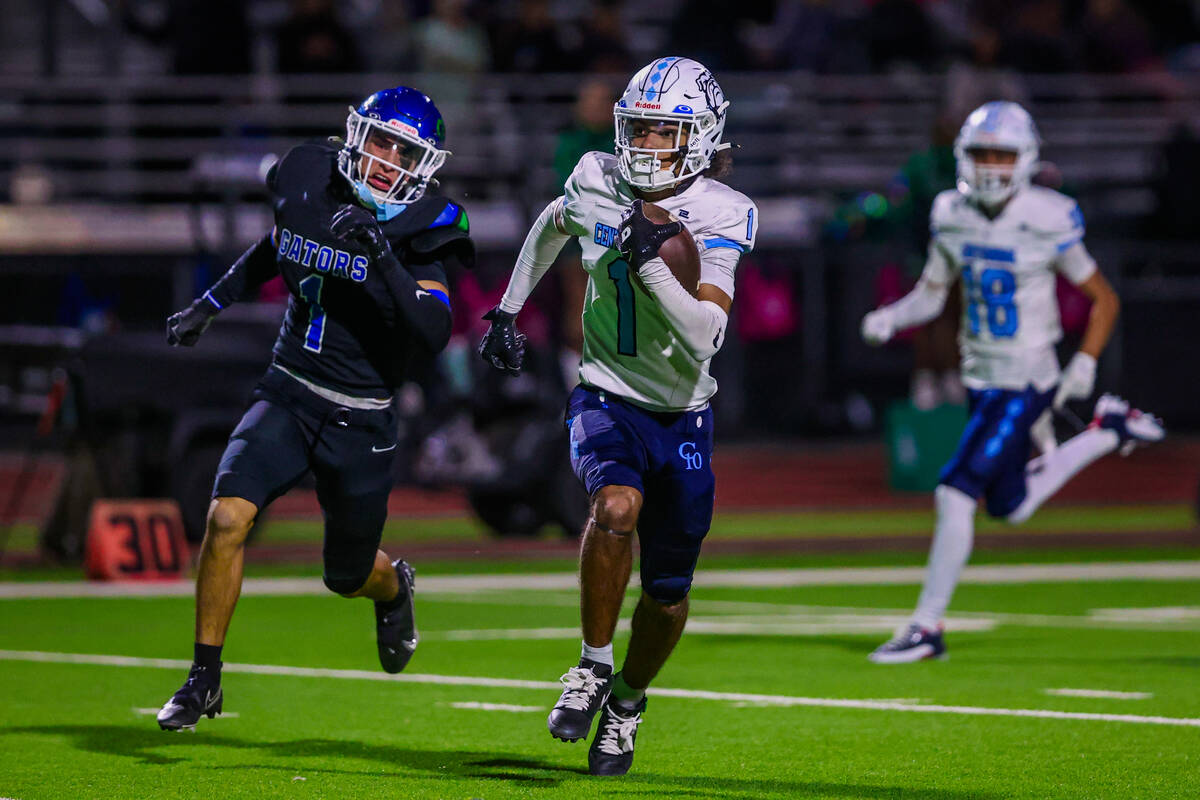 Centennial wide receiver Jayden Thomas runs the ball during a class 5A high school football sou ...