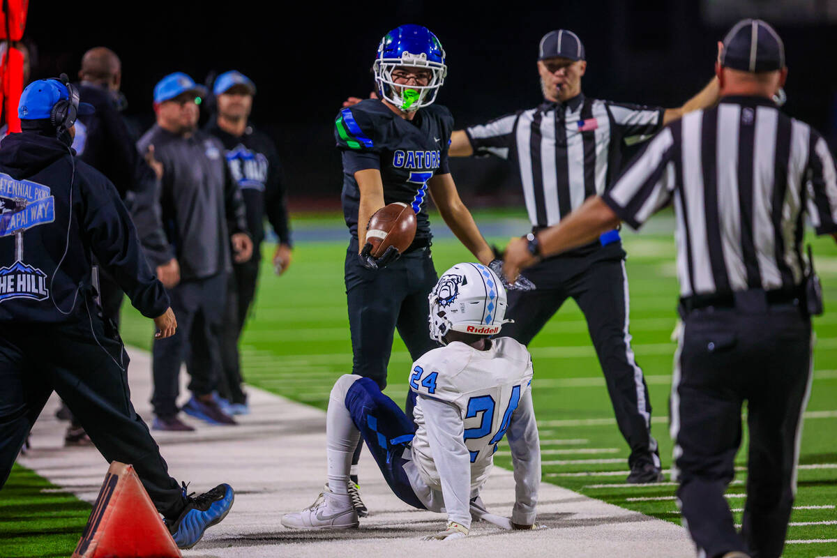 Green Valley wide receiver Sonny Uranich tries to reason with a referee during a class 5A high ...