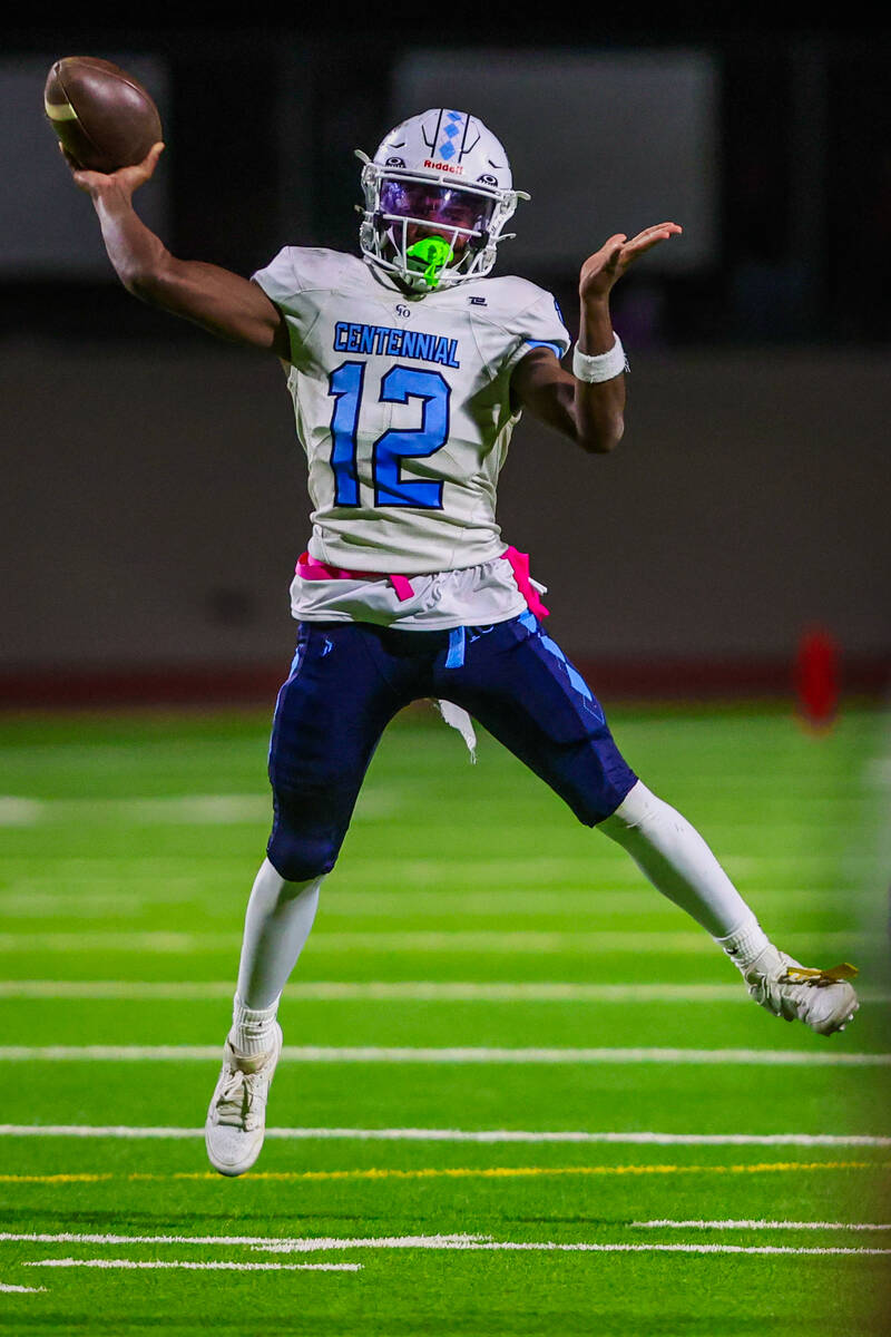 Centennial quarterback Nehemiah Dunlap-Myvett throws the ball during a class 5A high school foo ...