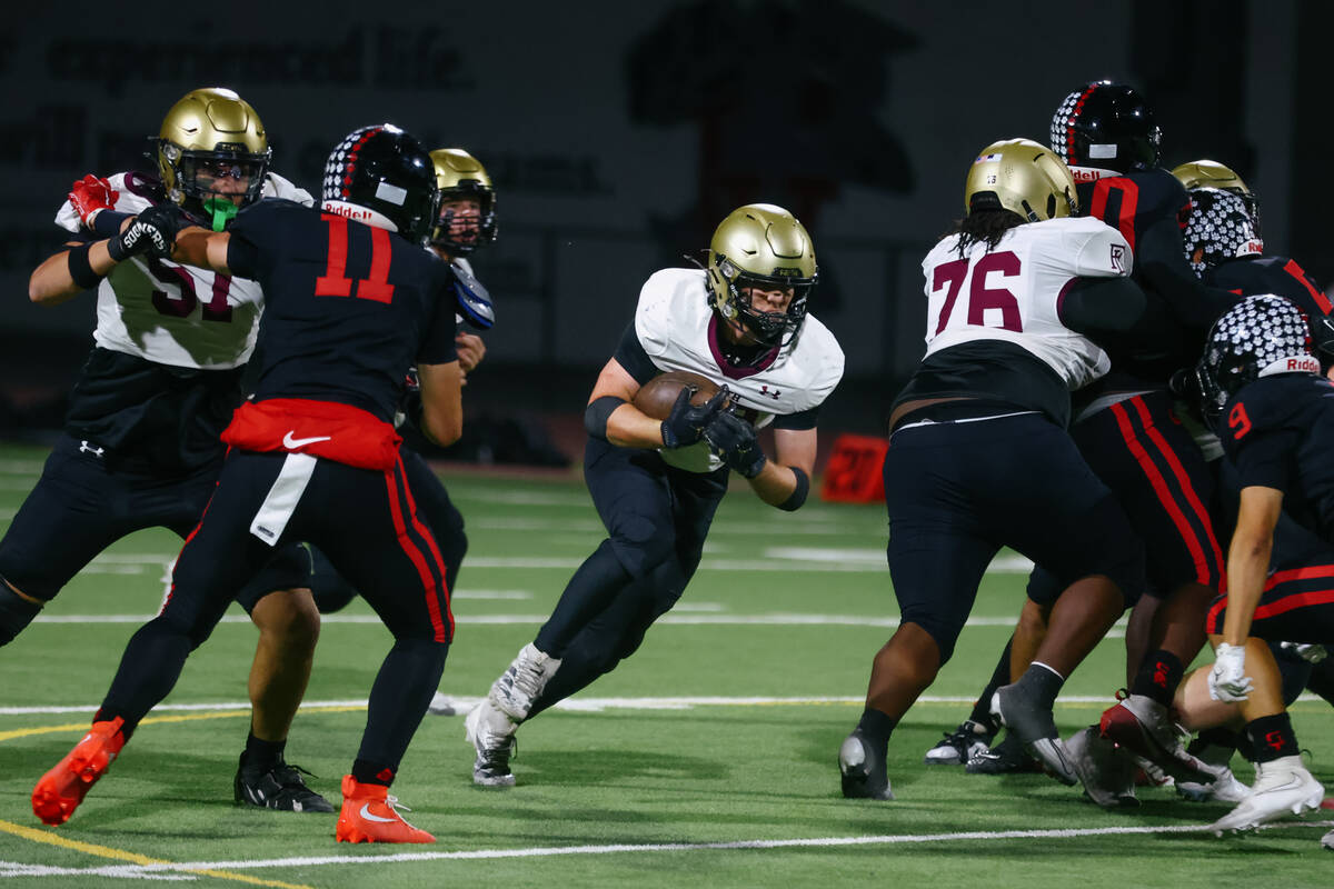 Faith Lutheran running back Justin Robbins (33) runs out of the pocket during the Southern Regi ...