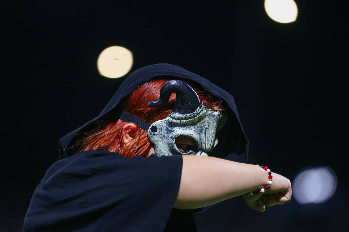 Members of the color guard dance through a fantasy-inspired routine as the Las Vegas High Schoo ...