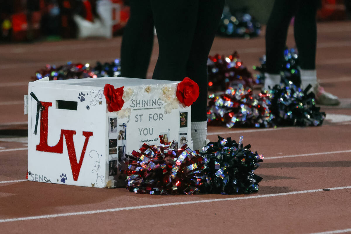 A Las Vegas High School cheerleader’s box sits on the track during the Southern Region s ...