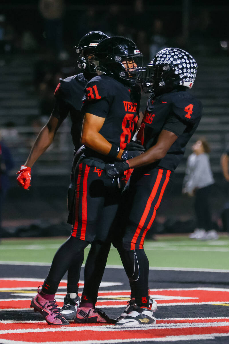 Las Vegas wide receiver Rian Jaime (81) and teammate Steven Bullock III (4) celebrate Jaime&#x2 ...