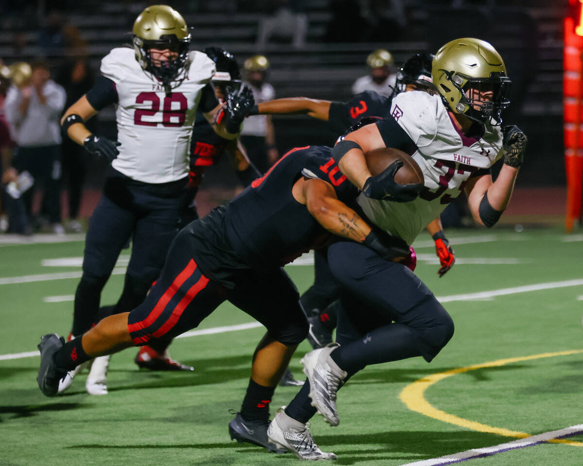 Las Vegas middle linebacker Chris Fernandez (10) tackles Faith Lutheran running back Justin Rob ...