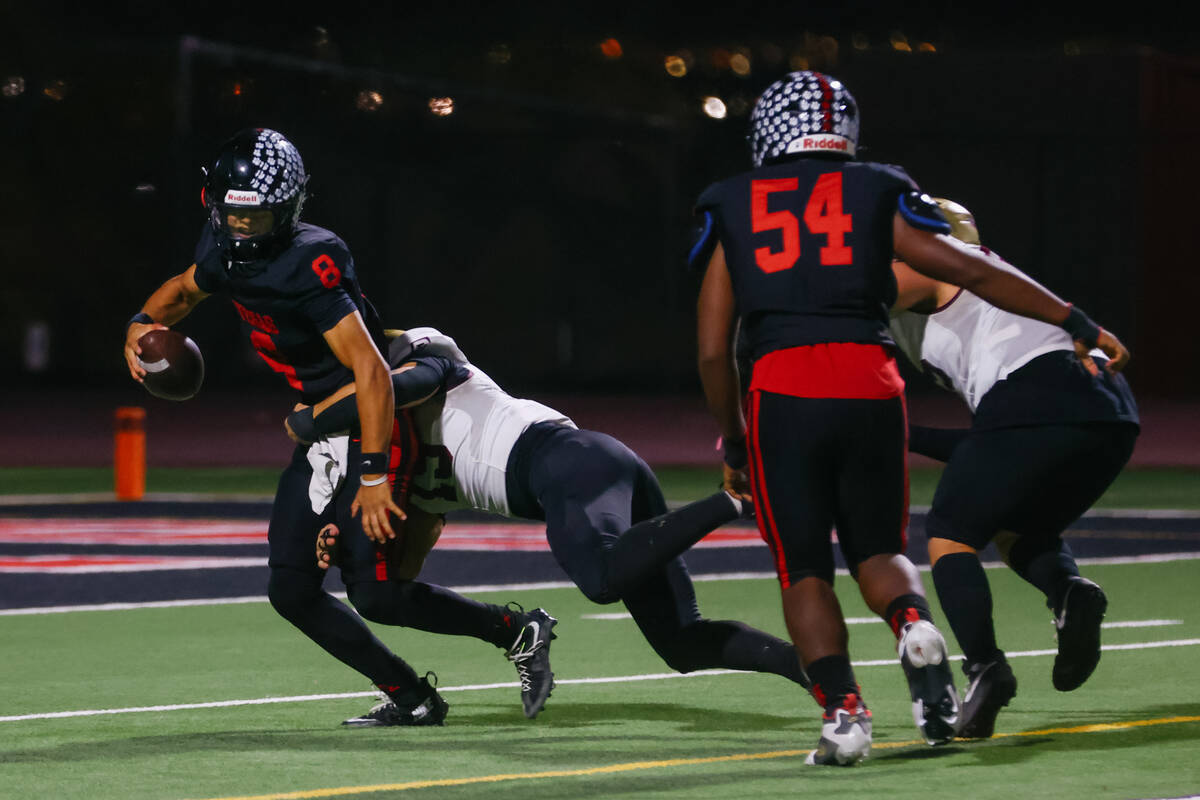Faith Lutheran defensive lineman Cooper Offermann (15) sacks Las Vegas quarterback Tanner Vibab ...