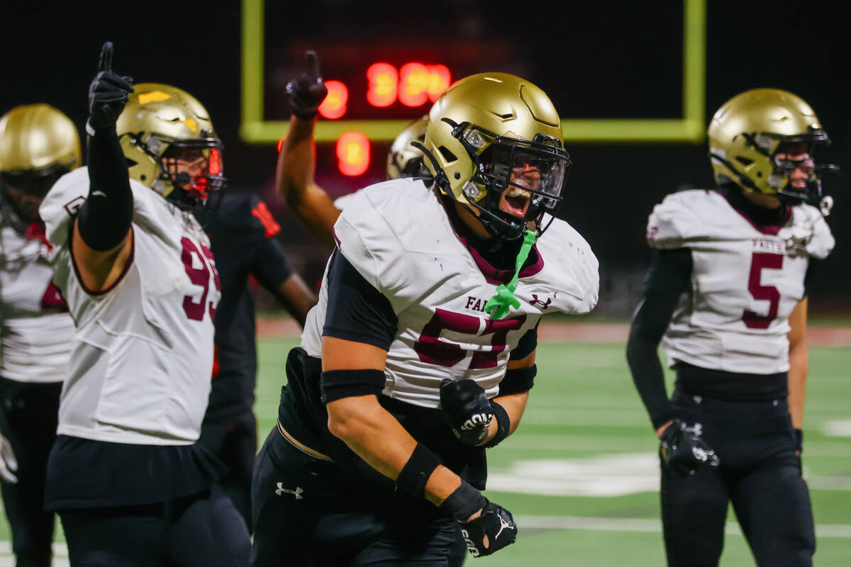 Faith Lutheran’s Carter Besser (57) celebrates making a stop against the Las Vegas Wildc ...