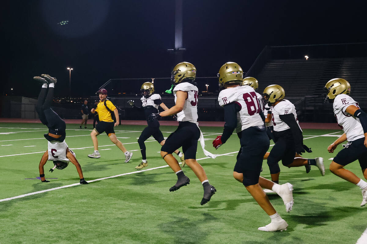 Faith Lutheran defensive back Treylon Fox (3) does a cartwheel and backflip to celebrate the Cr ...