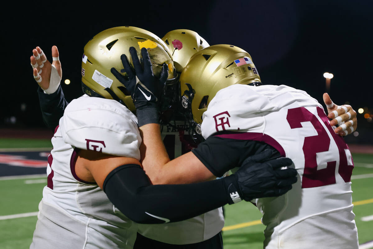 Faith Lutheran players embrace after the Crusaders’ 17-7 win over Las Vegas in the South ...