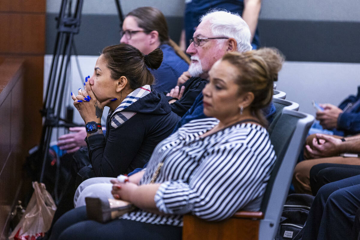 Family members look on as autopsy photos are examined during the murder trial for Devyn Michael ...