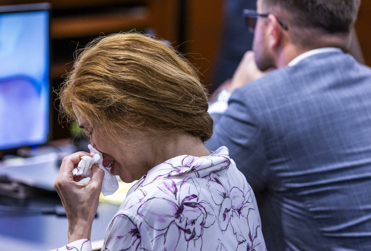 Devyn Michaels weeps as autopsy photos are shown of her on-again, off-again boyfriend Johnatha ...