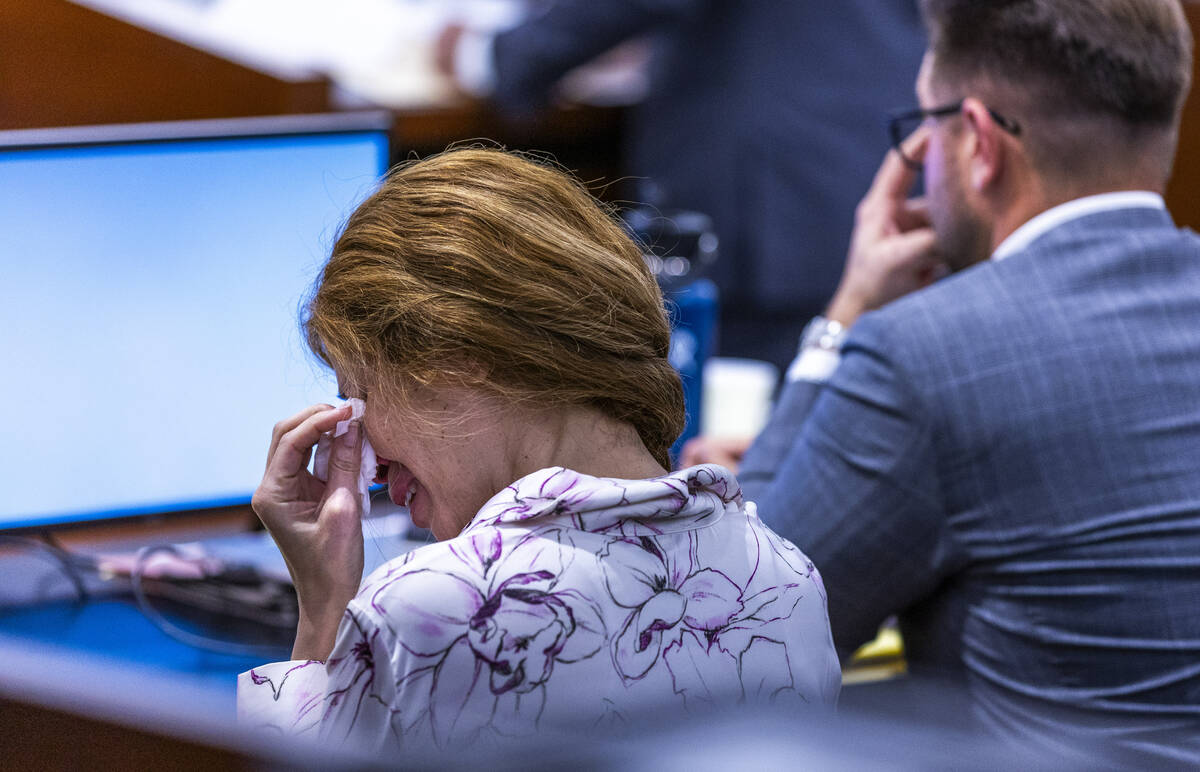 Devyn Michaels weeps as autopsy photos are shown of her on-again, off-again boyfriend Johnatha ...