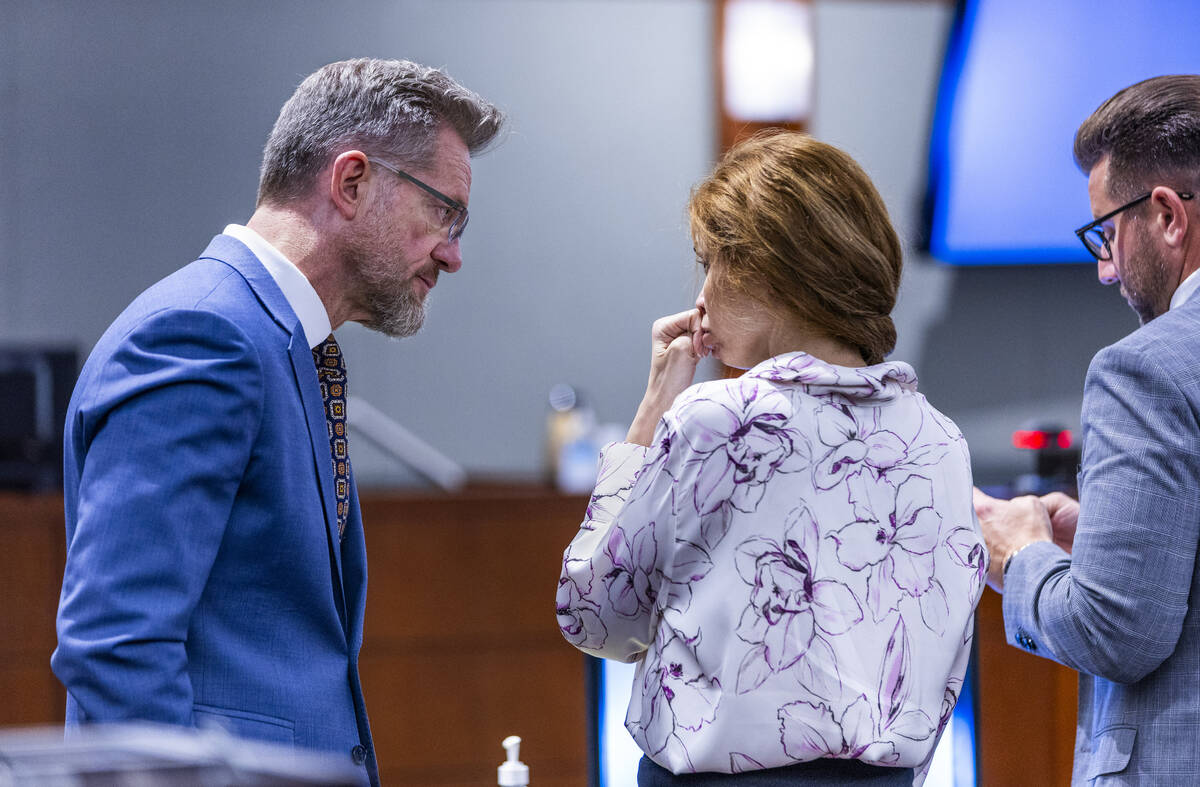 Defense attorney Robert Draskovich, representing Devyn Michaels, speaks with Devyn Michaels acc ...