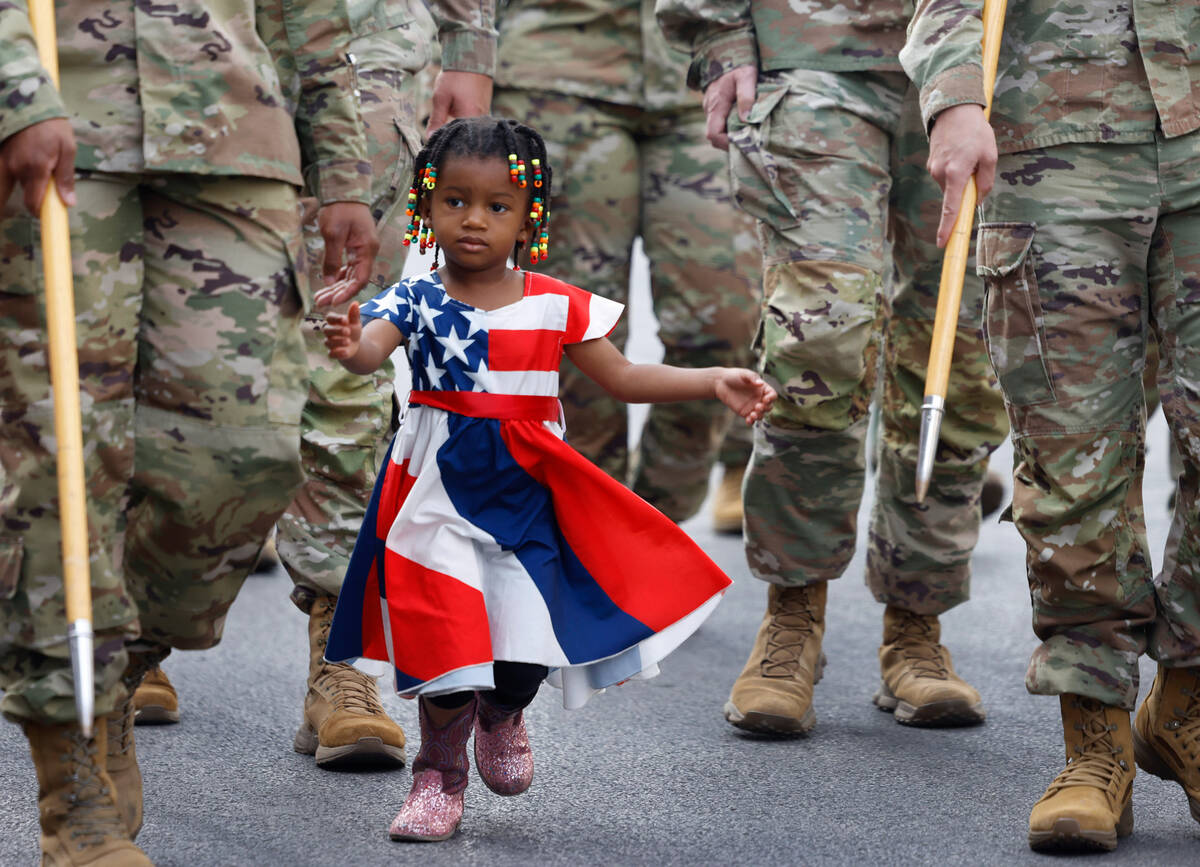 Aerial Lynch, 3, runs to hold her mother, Nevada Army National Guard Sgt. 1st Class Brittney Ly ...
