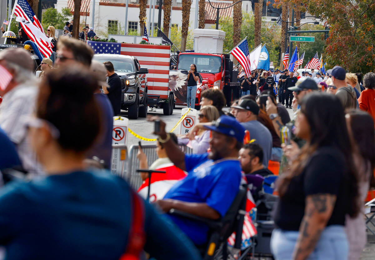 People watch the Annual Veterans Day Parade in downtown Las Vegas on Tuesday, Nov. 11, 2025. (B ...